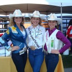 Three rodeo champions posing at Ag Day