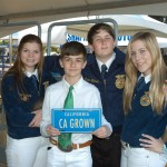 FFA students pose with a CA GROWN license plate