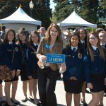 FFA students posing with a CA GROWN license plate