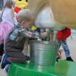 Milking Buttercup the electronic cow, part of the California Women for Agriculture booth