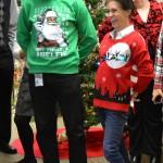 Inspection Services staff show of their holiday sweaters