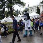 A healthcare mascot entertains children