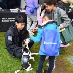 Myers, a detector dog, greets Ag Day attendees