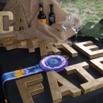 A purple ribbon on a State Fair display