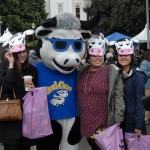 The "Cool Cow" mascot poses for photos at Ag Day