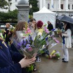 An FFA member holds a bouquet of flowers