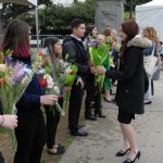 Ag Day attendees holding bouquets of flowers