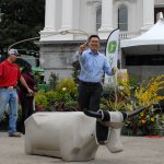 Assemblymember Vince Fong practices lasso on a dummy cow