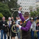 Assemblymember Matthew Harper swinging a lasso over his head
